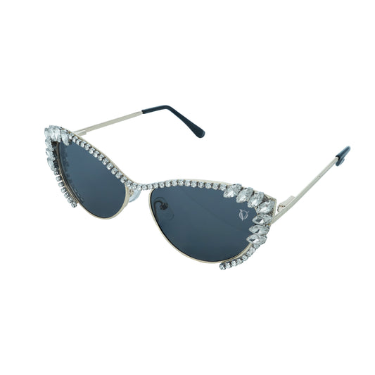 Woman wearing cat-eye sunglasses with dark lenses and a rhinestone-embellished frame-sunglasses view