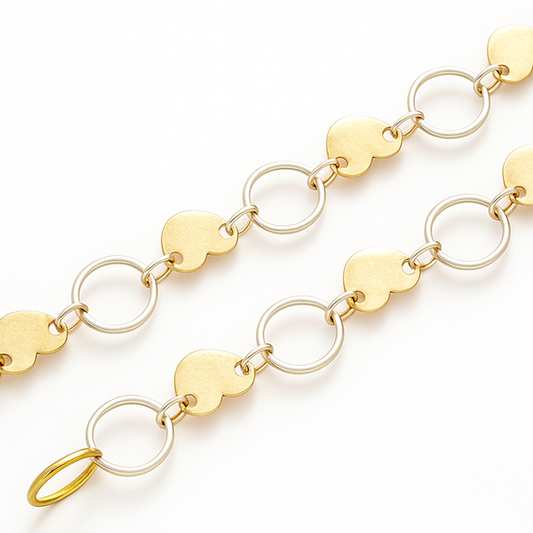 Gold dual linker chain with leaf shape disc linked to oval rings-zoomed view