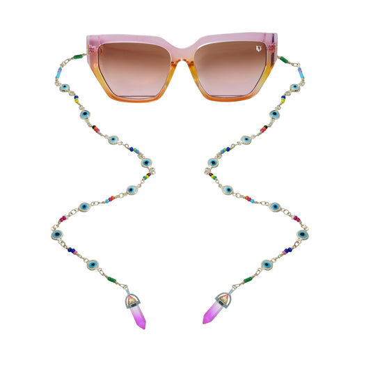 Brown sunglasses with brown gradient lenses attached to a colorful beaded chain featuring evil eye accents and crystal pendants-front view