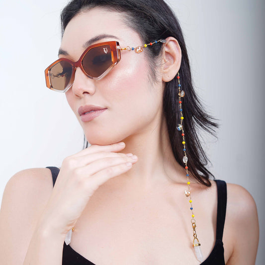 Bold oversized hexagonal frames with multicolored small beads balanced with light translucent crystal and white charms for women's fashion-side pose