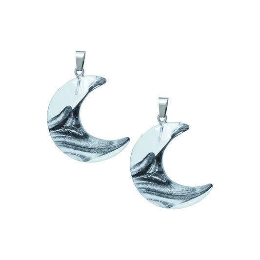Crescent moon-shaped glass charms with silver swirl design and metal loop-angle view