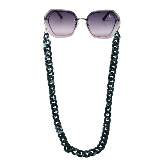 Sunglasses with purple gradient hexagonal frame lenses attached to a bold chunky black chain-front view