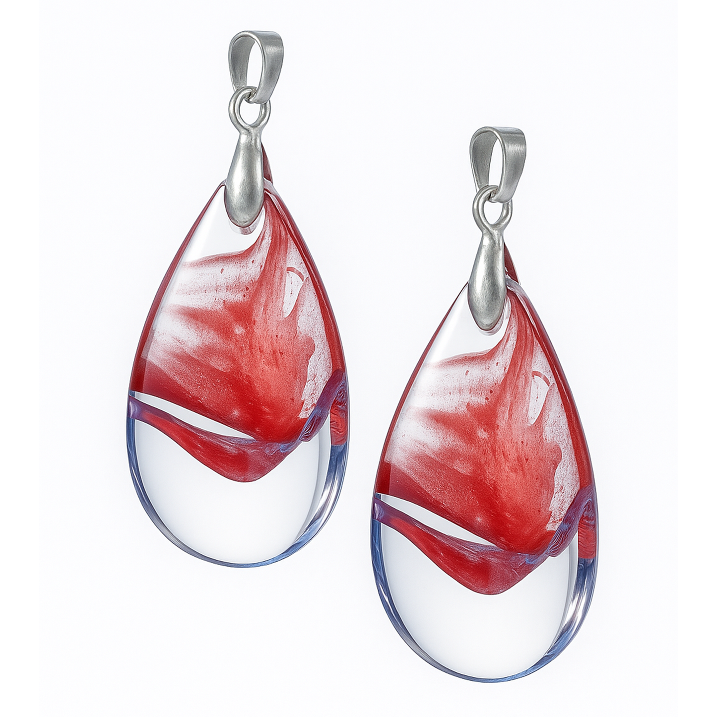 Teardrop-shaped glass pendants with red and white swirl design and silver hooks-front view