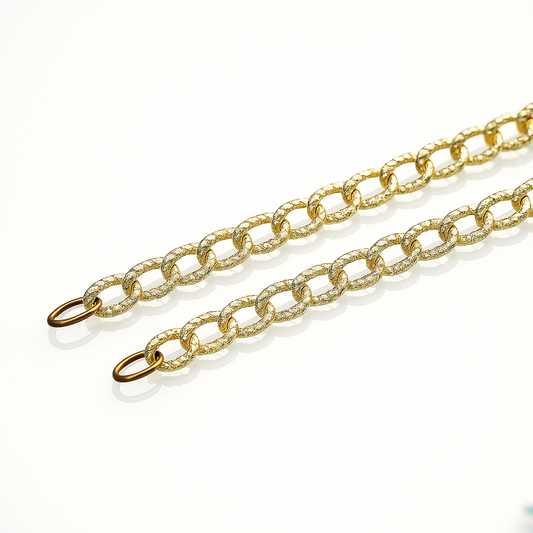 Gold chain with shimmering oval rings linked to each other