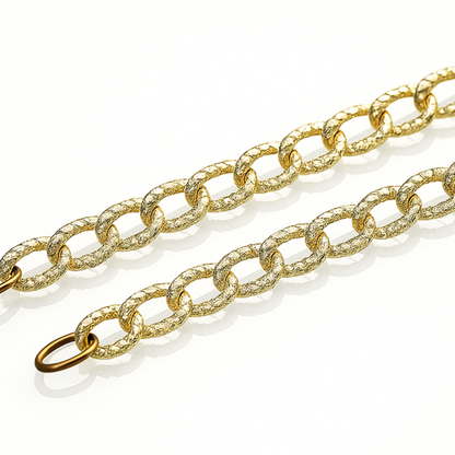 Gold chain with shimmering oval rings linked to each other-zoomed view