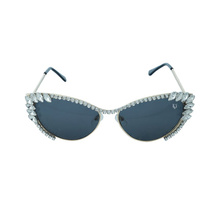 Woman wearing cat-eye sunglasses with dark lenses and a rhinestone-embellished frame-whole view