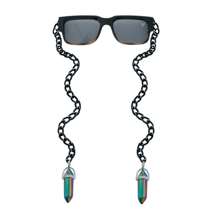 Black rectangular sunglasses with a decorative black chain strap and holographic, vibrant crystal charms attached at the ends-front view