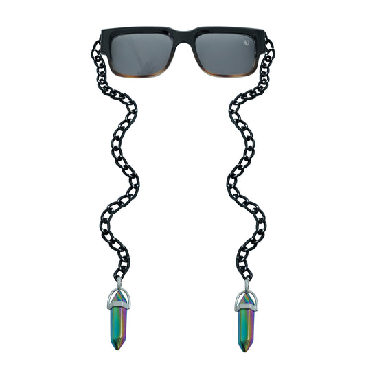 Black rectangular sunglasses with a decorative black chain strap and holographic, vibrant crystal charms attached at the ends-front view