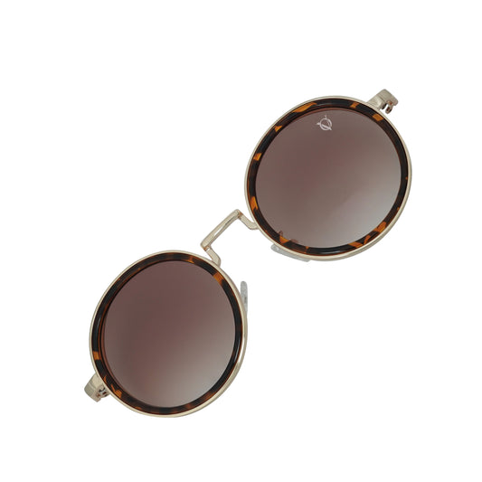 Round sunglasses with dark tinted lenses and a thin metallic frame with tortoiseshell detailing-angle view