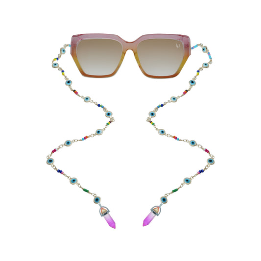 Square pink gradient sunglasses with a colorful beaded chain strap featuring blue evil eye charms and pink crystal pendants at the ends-front view