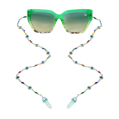 Green sunglasses with gradient lenses attached to a colorful beaded chain featuring evil eye accents and crystal pendants-front view