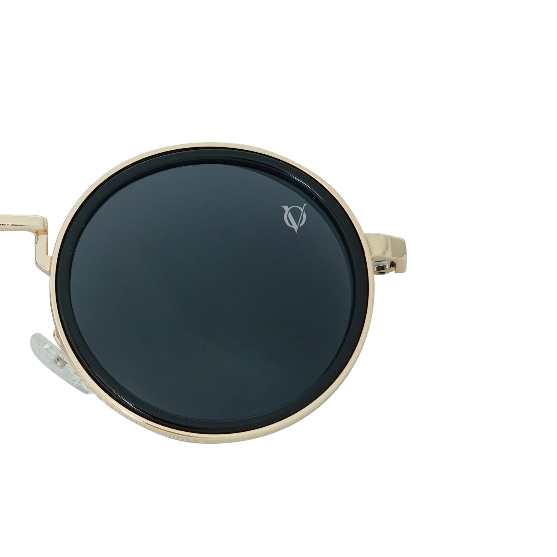 Round sunglasses with dark lenses, a gold frame, and a dual-link gold chain strap, or oval rings and leaf discs featuring black charms-lense view
