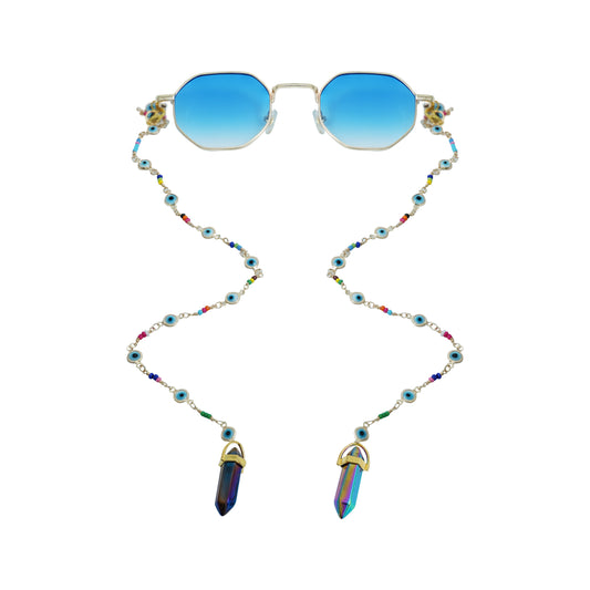 Blue-lensed sunglasses with a silver frame are attached to a beaded chain featuring blue and multicolored accents, ending in two crystal charms-front view