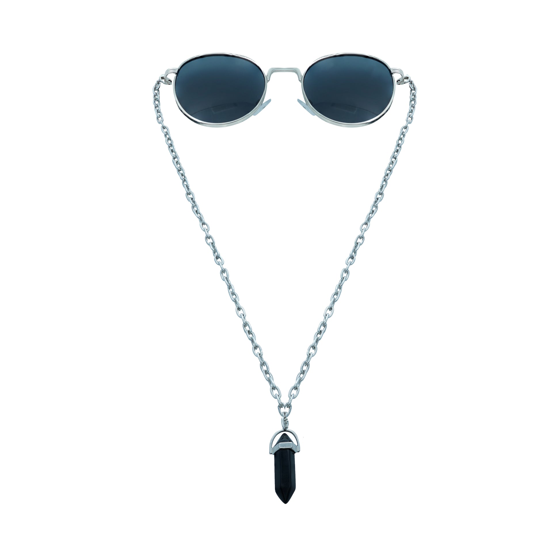 A pair of round, dark-lensed sunglasses with a silver frame is connected to a silver chain, which holds a pendant shaped black crystal-front view