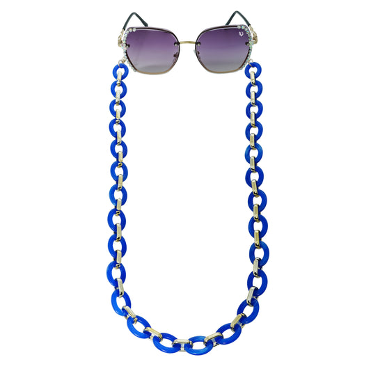 Sunglasses with gradient lenses attached to a bold chunky blue chain -front view
