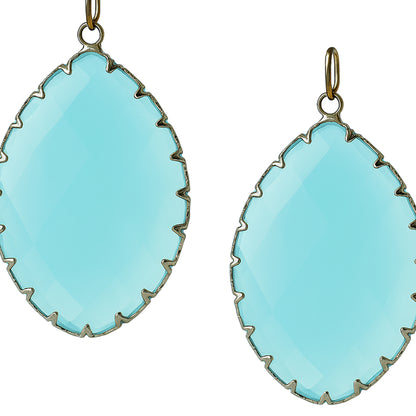 Teardrop-shaped aqua blue gemstone pendants with a gold prong setting-zoomed view