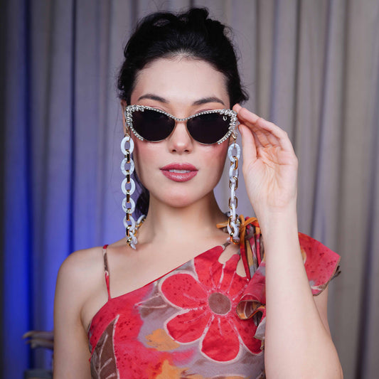 Best crystal-studded cat-eye frames sunglasses with a white chain linked with a gold linker for women's to go to a party-front pose