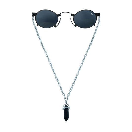 Round black sunglasses with a silver chain featuring a black crystal pendant-front view