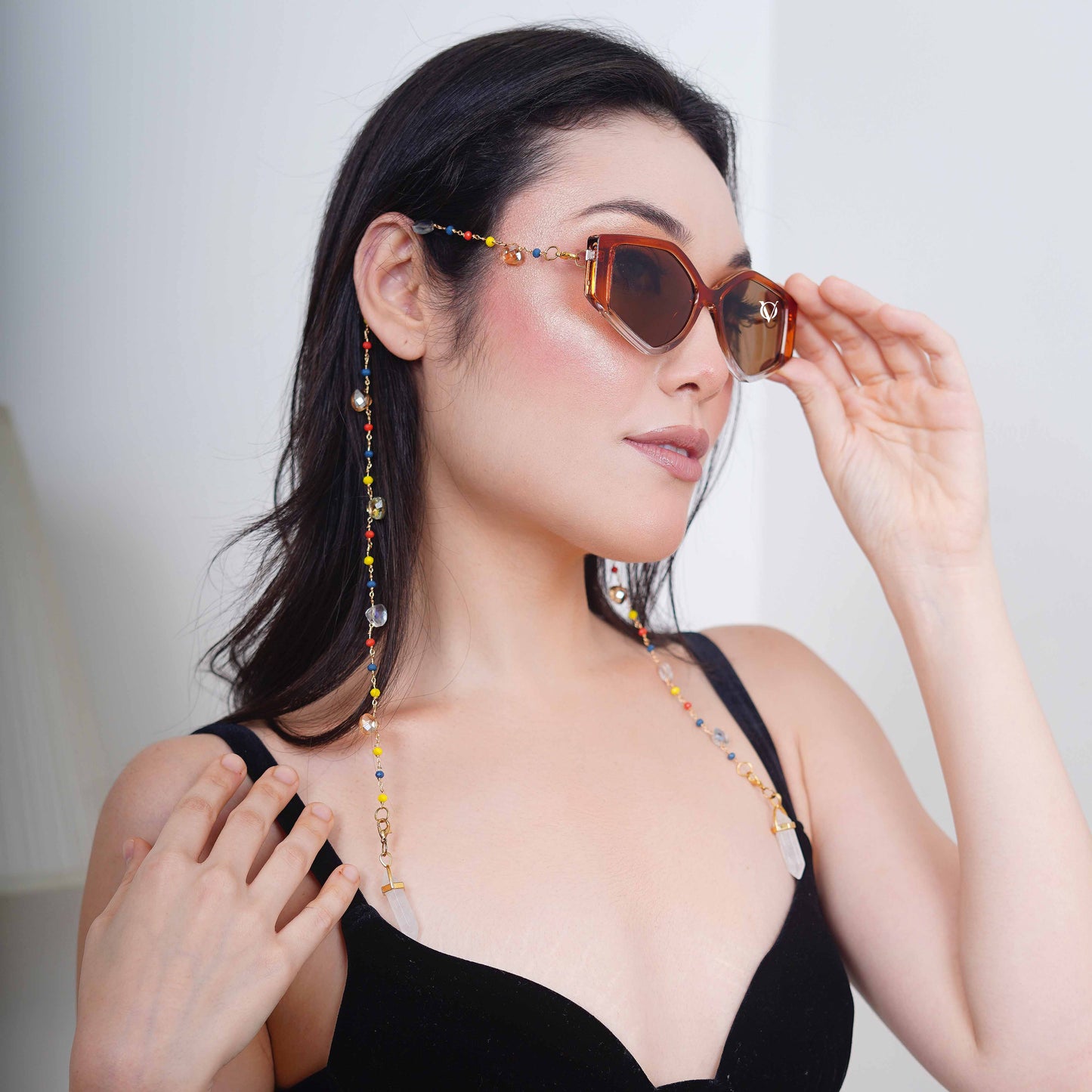 Bold oversized hexagonal frames with multicolored small beads balanced with light translucent crystal and white charms for women's fashion-angle pose