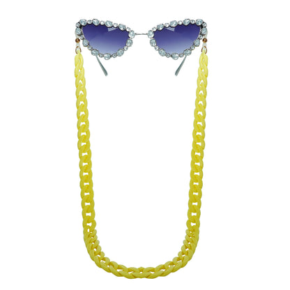 Glimmery oval crystal-studded cat-eye frames with blue gradient lenses attached with a yellow funky chain for trend lovers. 