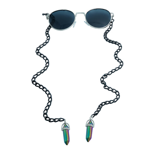 A pair of round, dark-lensed sunglasses with a silver frame is connected to a black chain, which holds a pendant shaped holographic vibrant rainbow crystal-front view