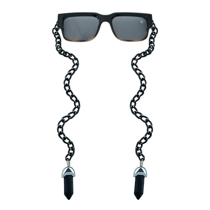 Black rectangular sunglasses with a decorative black chain strap and black crystal charms attached at the ends-front view