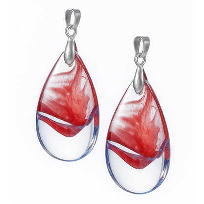 Teardrop-shaped glass pendants with red and white swirl design and silver hooks-front view