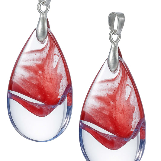 Teardrop-shaped glass pendants with red and white swirl design and silver hooks-zoomed view